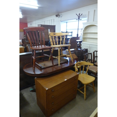 330 - A teak chest of drawers, a/f, a mahogany dining table and three chairs