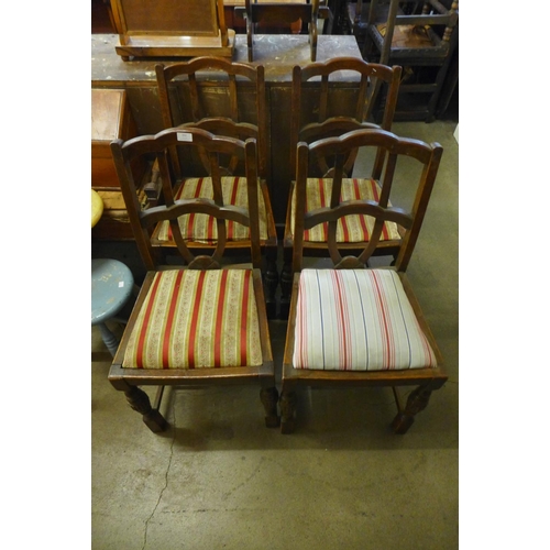 332 - A set of four oak dining chairs