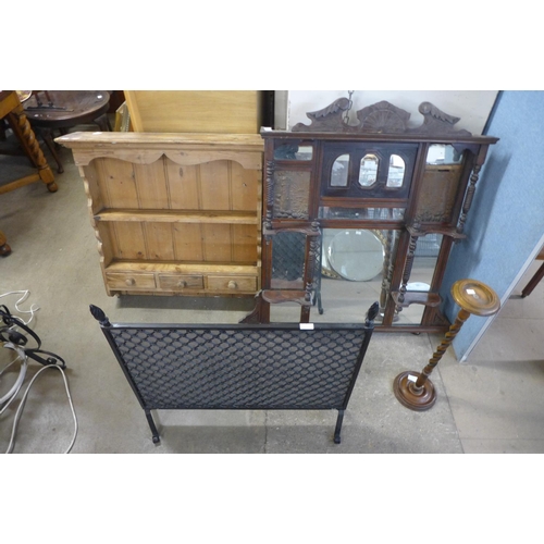 334 - A Victorian mahogany overmantel mirror, a pine Delft rack, an oak barleytwist smoker's stand and a s... 