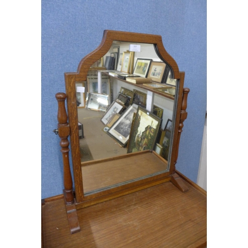 337 - An oak dressing table mirror