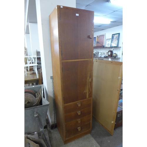 342 - A tall light oak office locker cabinet