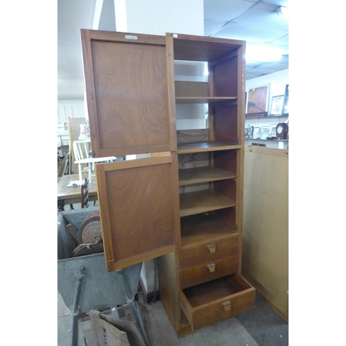 342 - A tall light oak office locker cabinet