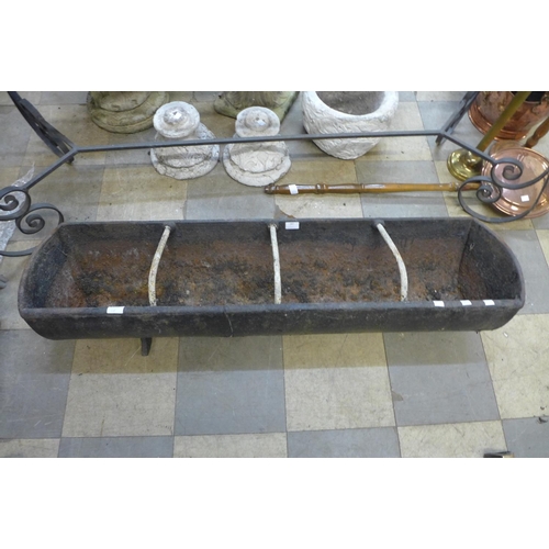 347 - Two cast iron feeding troughs