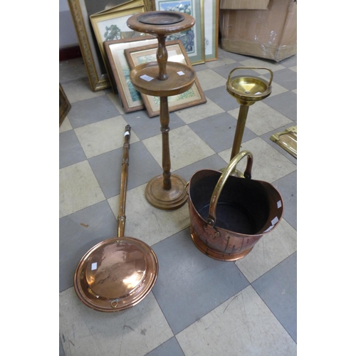 349 - A Victorian copper coal scuttle, a copper warming pan and two smokers stands