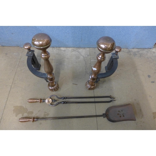 353 - A copper and cast iron companion set and andirons