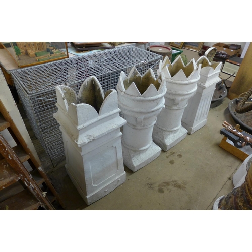 356 - Four painted crown top chimney pots