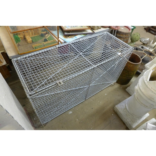 357 - A galvanised wirework storage cage, 70cms h, 122cms w, 46cms d