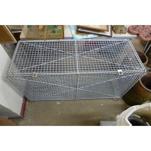 357 - A galvanised wirework storage cage, 70cms h, 122cms w, 46cms d