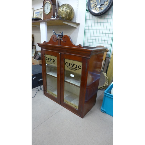 394 - A Victorian mahogany counter top shop cabinet, bearing Civic Company Limited inscription to doors, 7... 