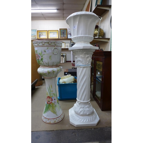 400 - A blue and white porcelain vase, two jardinieres on stands and three light shades