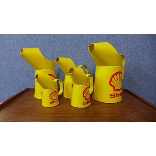 404 - A set of five graduated Shell advertising jugs