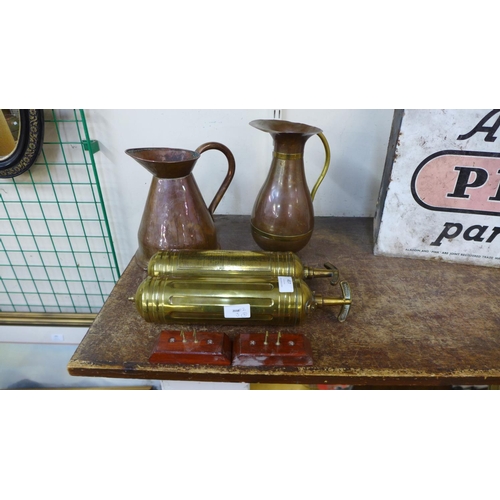 407 - Two brass fire extinguishers and two copper jugs