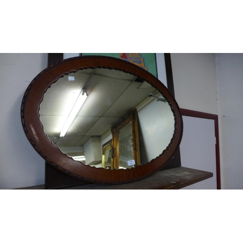 408 - An Edward VII mahogany oval framed mirror