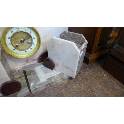 409 - A French Art Deco marble clock garniture