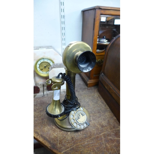 410 - A brass candlestick telephone