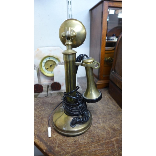 410 - A brass candlestick telephone