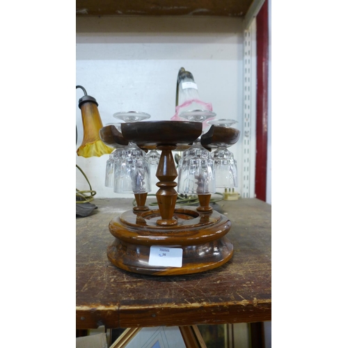 417 - A set of six liquer glasses, on treen stand, marked Mallorca