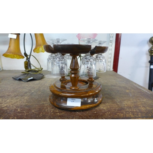 417 - A set of six liquer glasses, on treen stand, marked Mallorca