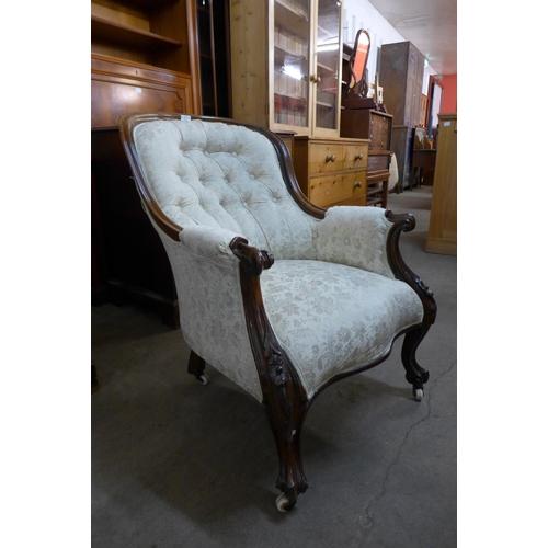 42 - An early Victorian rosewood and upholstered armchair, 91cms h, 69cms w, 85cms d