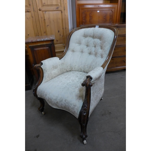 42 - An early Victorian rosewood and upholstered armchair, 91cms h, 69cms w, 85cms d