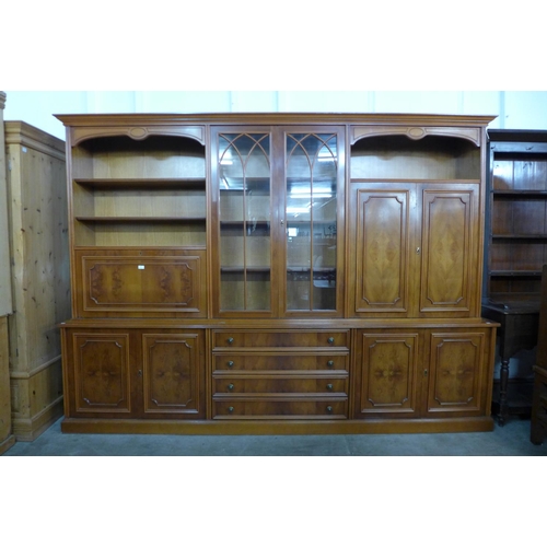 44 - A large yew wood bookcase, 210cms h, 290cms w, 48cms d