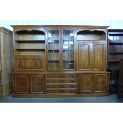 44 - A large yew wood bookcase, 210cms h, 290cms w, 48cms d