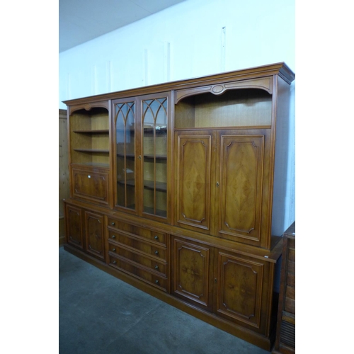 44 - A large yew wood bookcase, 210cms h, 290cms w, 48cms d