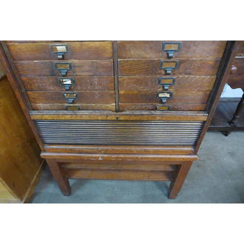 46 - A Victorian oak tambour front sixteen drawer office cabinet, 115cms h, 86cms w, 40cms d