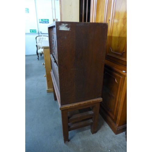 46 - A Victorian oak tambour front sixteen drawer office cabinet, 115cms h, 86cms w, 40cms d