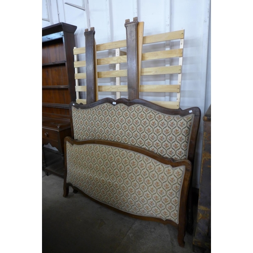 49 - A French beech and upholstered double bed