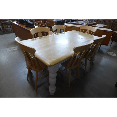 52 - A painted beech farmhouse kitchen table (74cms h, 184cms l, 99cms w) and six beech chairs