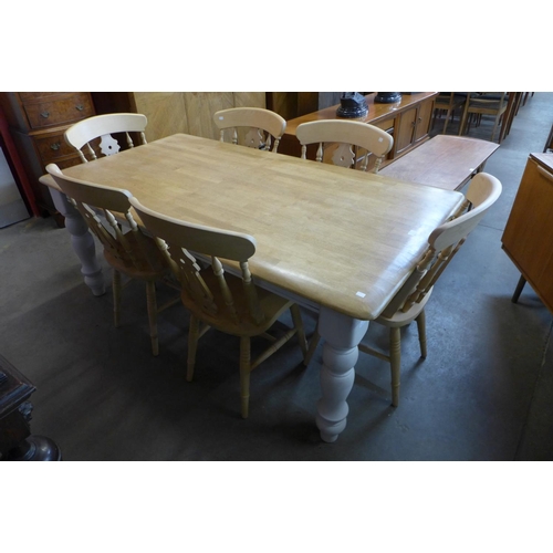 52 - A painted beech farmhouse kitchen table (74cms h, 184cms l, 99cms w) and six beech chairs