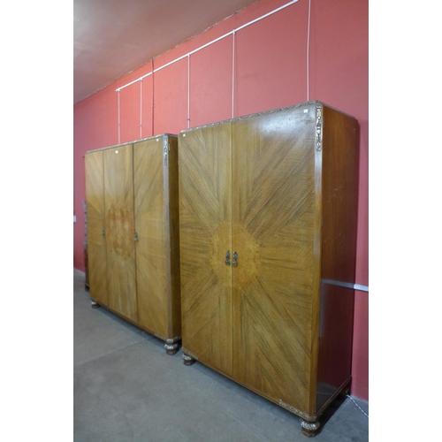 54 - A pair of Art Deco walnut, burr walnut and parcel gilt fitted wardrobes, 194cms h, 169cms w, 56cms d... 