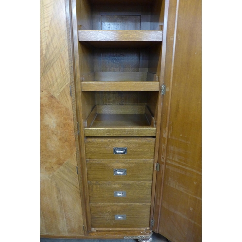 54 - A pair of Art Deco walnut, burr walnut and parcel gilt fitted wardrobes, 194cms h, 169cms w, 56cms d... 