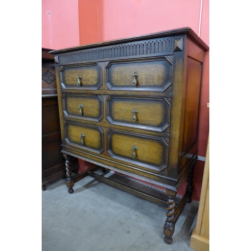 56 - A Jacobean Revival oak geometric moulded chest of drawers, 108cms h, 92cms w, 48cms d