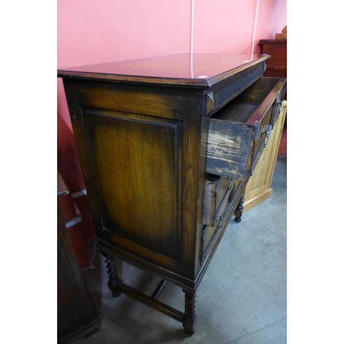 56 - A Jacobean Revival oak geometric moulded chest of drawers, 108cms h, 92cms w, 48cms d