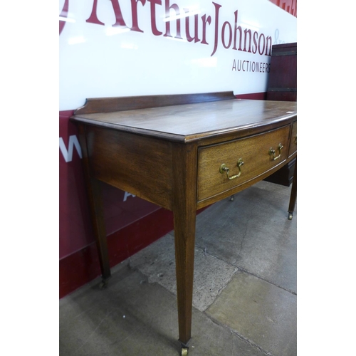 65 - An Edward VII mahogany bow front two drawer side table, 82cms h, 122cms w, 57cms d