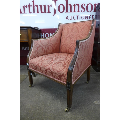 66 - A Victorian carved mahogany and upholstered armchair, 82cms h, 62cms w, 64cms w