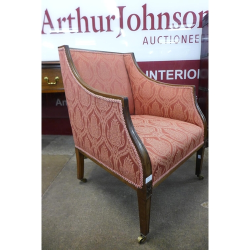 66 - A Victorian carved mahogany and upholstered armchair, 82cms h, 62cms w, 64cms w