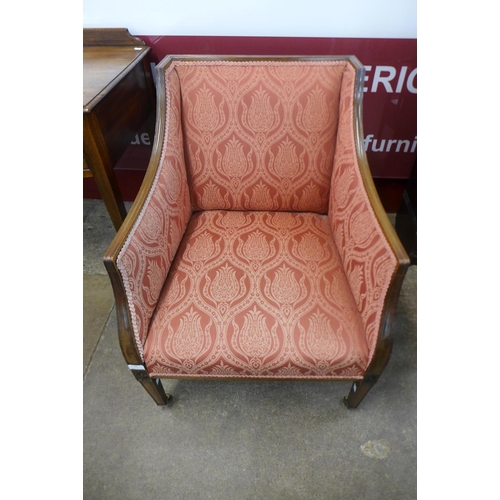 66 - A Victorian carved mahogany and upholstered armchair, 82cms h, 62cms w, 64cms w