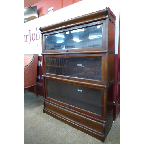 69 - An early 20th Century Globe Wernicke oak three tier sectional stacking bookcase, 115cms h 87cms w, 2... 