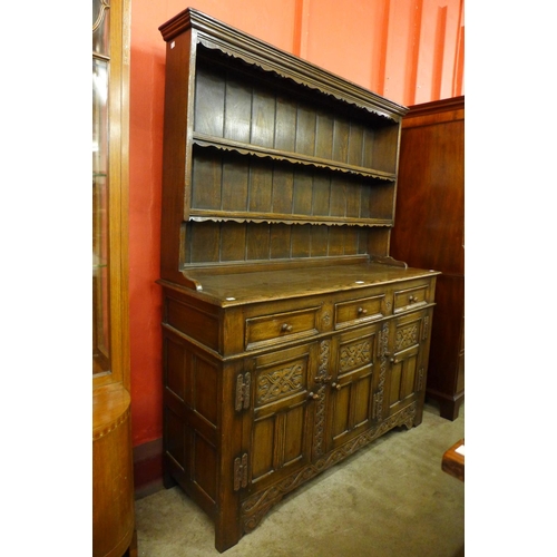 73 - A carved Ipswich oak dresser, 173cms h, 137cms w, 46cms d