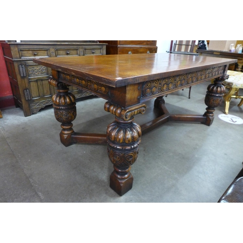 77 - An Elizabethan Revival carved oak refectory table, 76cms h, 183cms l, 91cms w