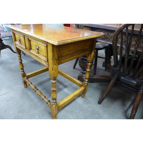 80 - A 17th Century style Ipswich oak side table, 71cms h x 77cms w