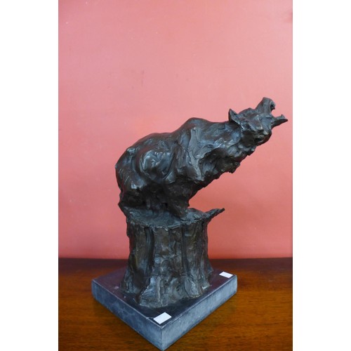 89 - A bronze figure of a grizzly bear, on black marble socle, 39cms h