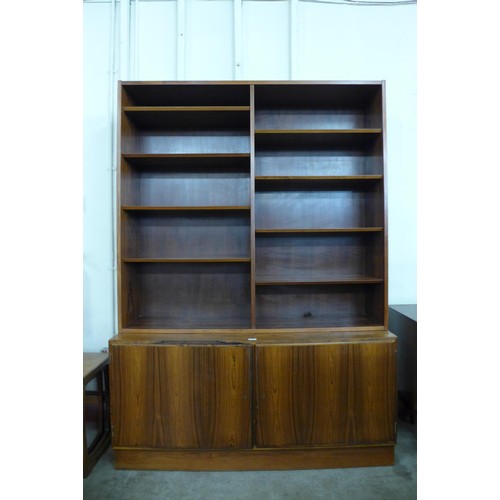 99 - A Danish Poul Hundevad rosewood bookcase, 197cms h, 139cms w, 43cms d 

*Accompanied by CITES A10 ce... 