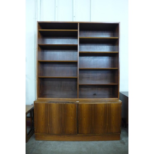 99 - A Danish Poul Hundevad rosewood bookcase, 197cms h, 139cms w, 43cms d 

*Accompanied by CITES A10 ce... 