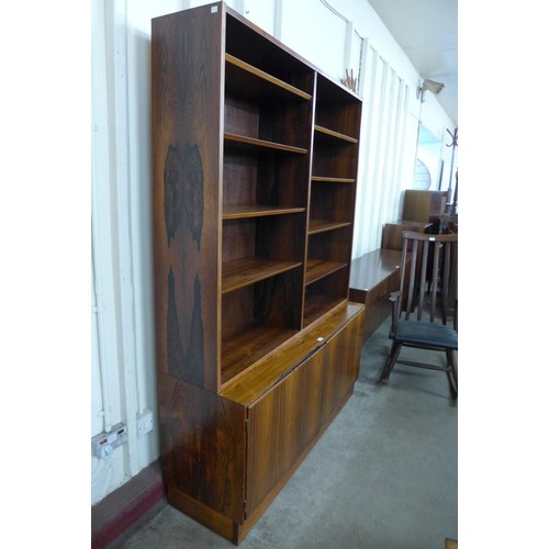 99 - A Danish Poul Hundevad rosewood bookcase, 197cms h, 139cms w, 43cms d 

*Accompanied by CITES A10 ce... 