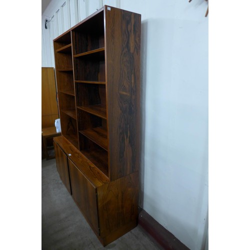 99 - A Danish Poul Hundevad rosewood bookcase, 197cms h, 139cms w, 43cms d 

*Accompanied by CITES A10 ce... 