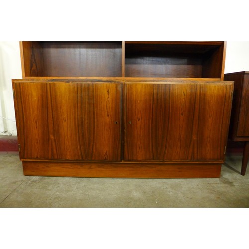 99 - A Danish Poul Hundevad rosewood bookcase, 197cms h, 139cms w, 43cms d 

*Accompanied by CITES A10 ce... 